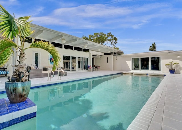 outdoor pool with a patio