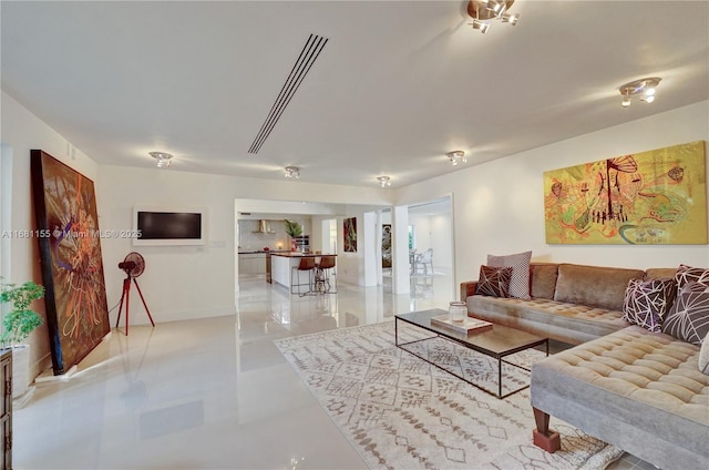 living room featuring baseboards