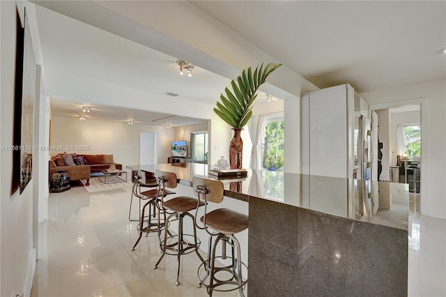 dining space with light tile patterned floors