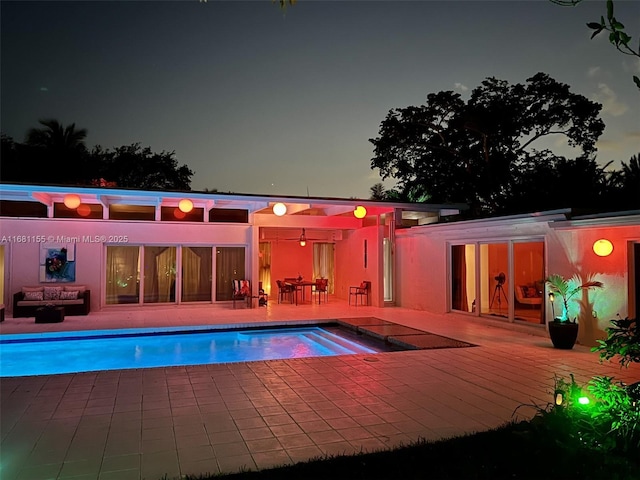 pool featuring a patio area and a wooden deck