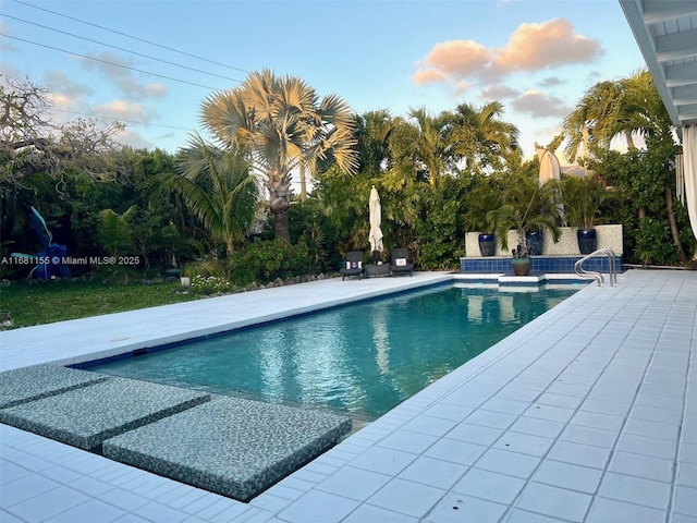 outdoor pool with a patio