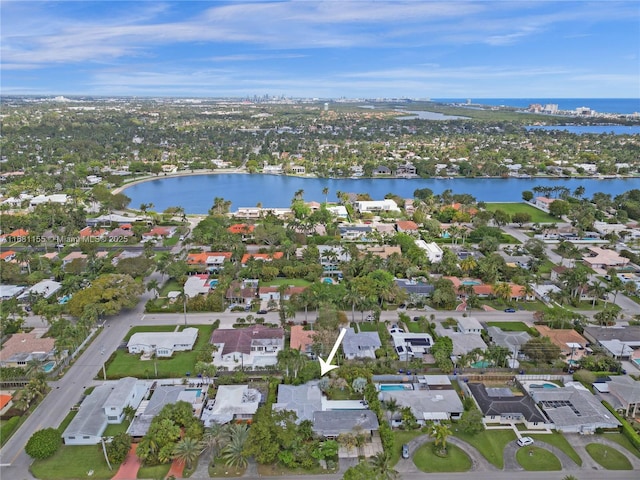 bird's eye view featuring a water view and a residential view