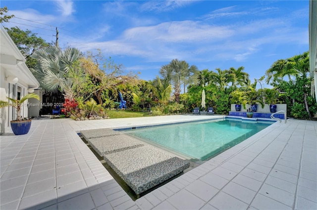 outdoor pool featuring a patio area