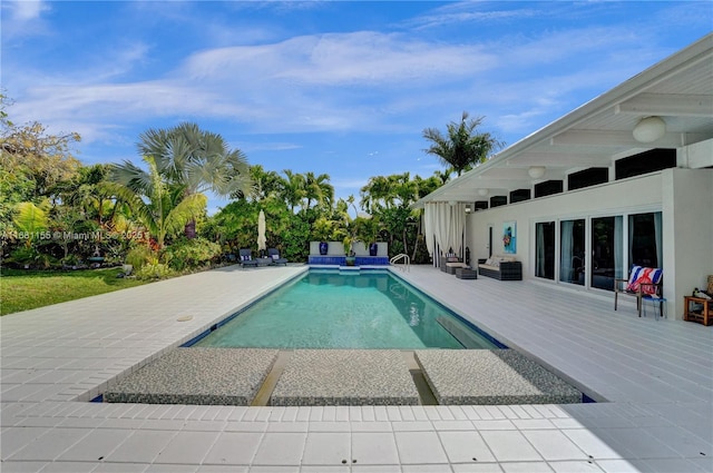 outdoor pool featuring a patio area