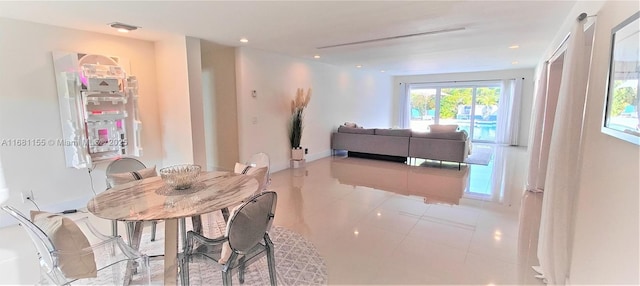 dining room featuring light tile patterned flooring