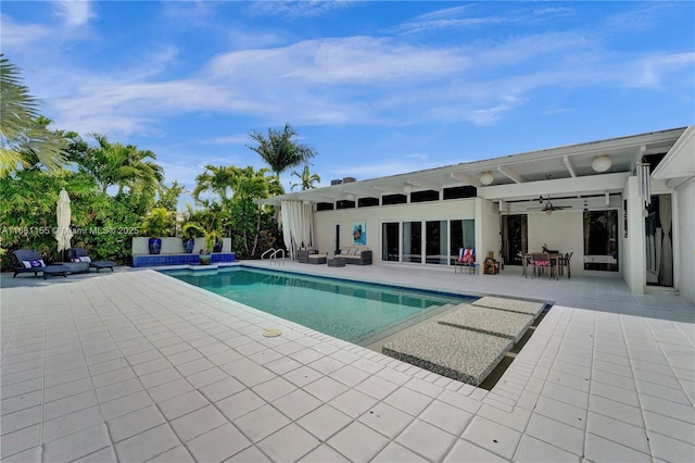 pool featuring ceiling fan and a patio