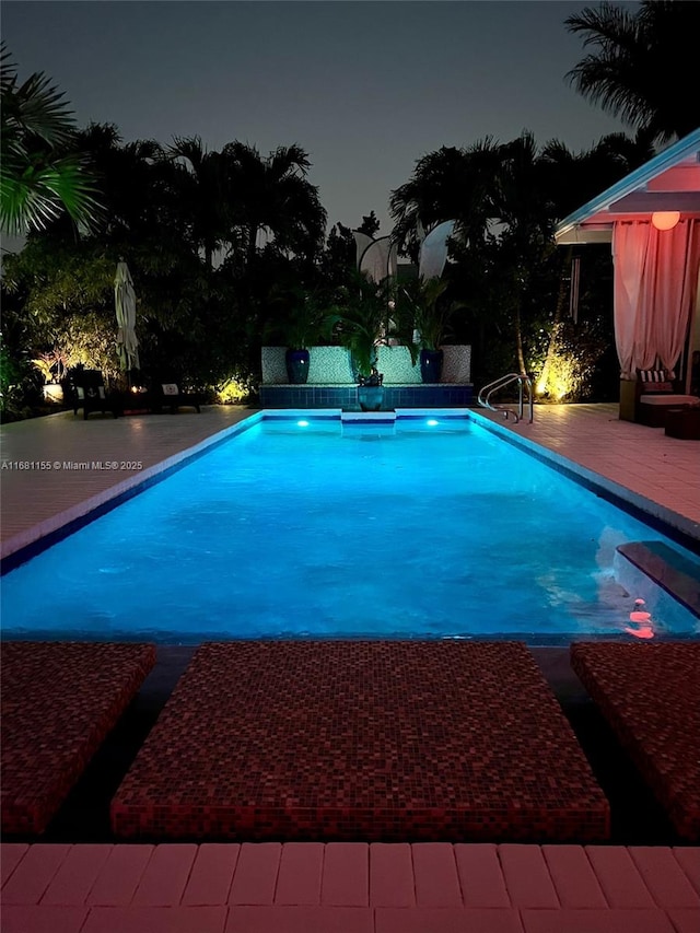 outdoor pool featuring a wooden deck