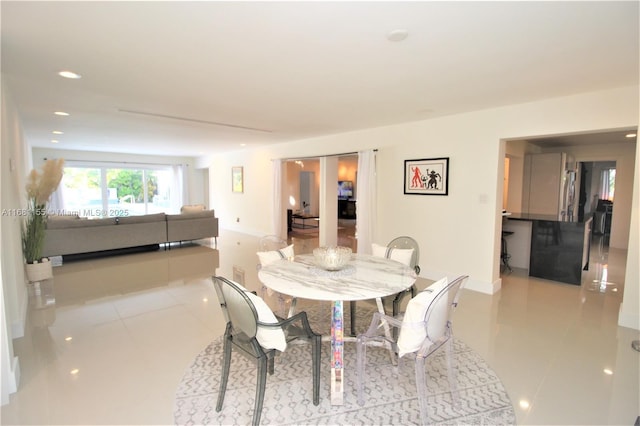 dining room featuring recessed lighting and light tile patterned flooring