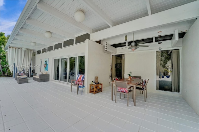 view of patio featuring outdoor dining area and ceiling fan