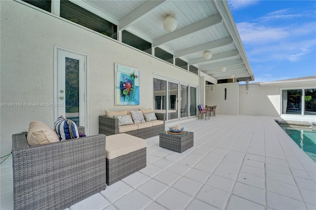 view of patio / terrace featuring an outdoor living space and an outdoor pool