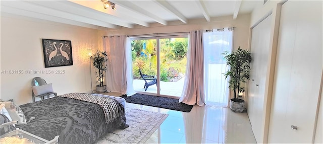 bedroom with access to outside, beam ceiling, and tile patterned floors