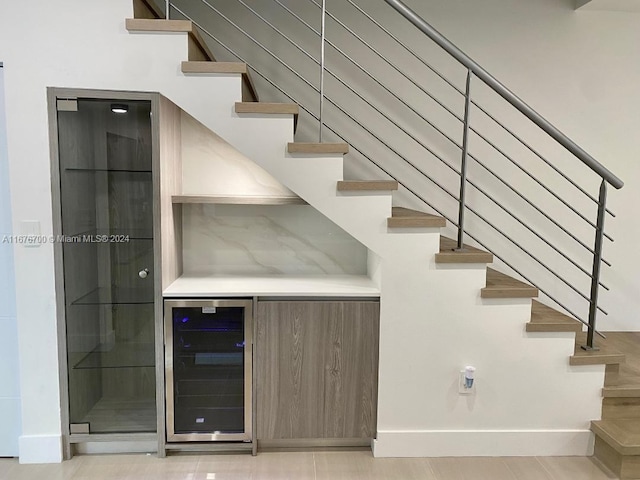 stairs featuring bar and wine cooler