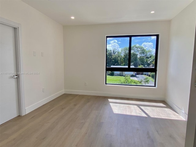 unfurnished room featuring light hardwood / wood-style floors