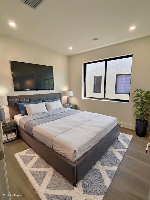 bedroom featuring hardwood / wood-style floors