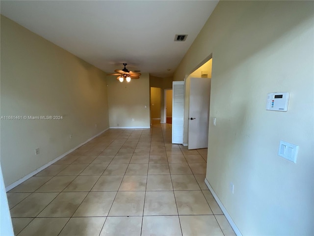 unfurnished room featuring ceiling fan and light tile patterned floors