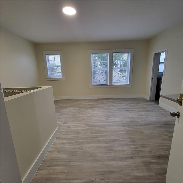 spare room featuring light hardwood / wood-style floors