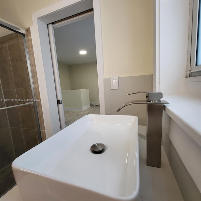 bathroom featuring an enclosed shower