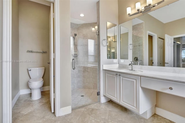 bathroom with tile patterned flooring, vanity, toilet, and a shower with shower door