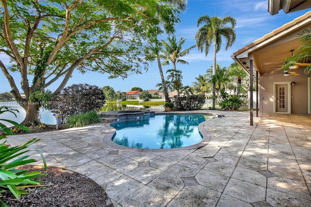 view of swimming pool featuring an in ground hot tub and a patio