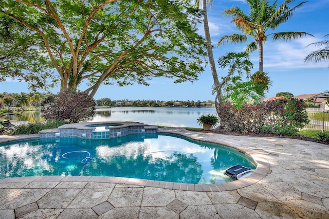 view of pool with a water view, an in ground hot tub, and a patio