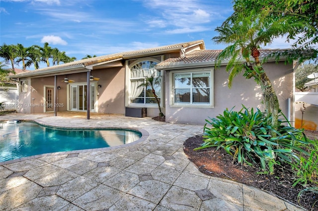 back of house featuring a patio area and ceiling fan