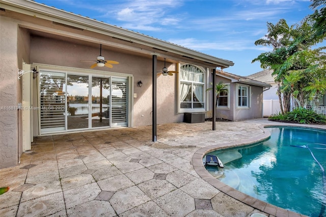 view of pool featuring a patio and ceiling fan