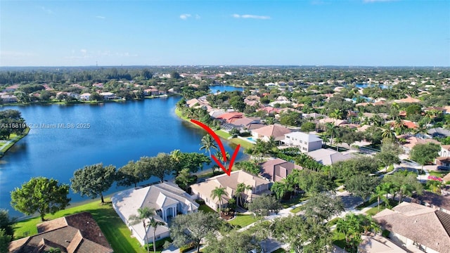 birds eye view of property with a water view