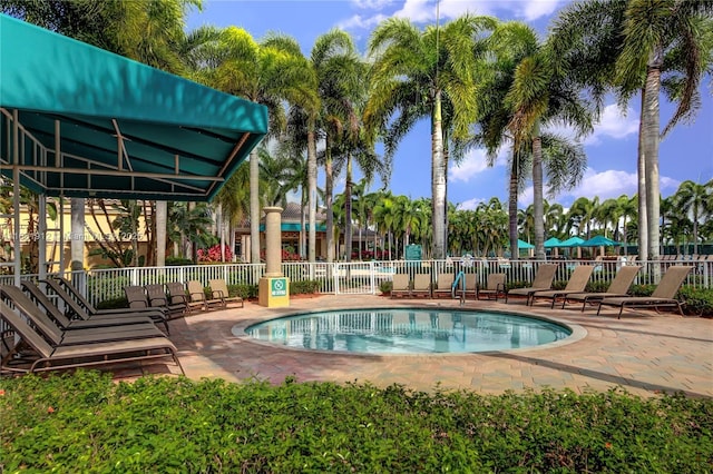 view of swimming pool with a patio