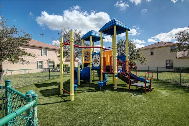 view of playground featuring a lawn