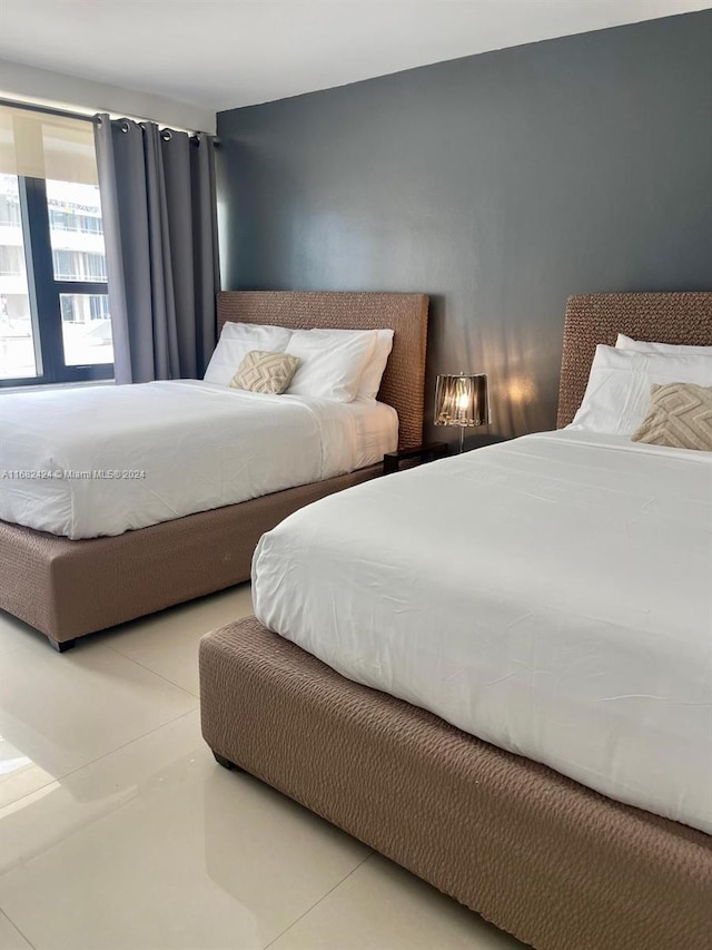 bedroom with tile patterned floors