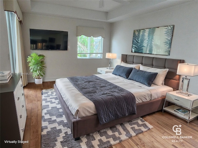 bedroom with hardwood / wood-style floors