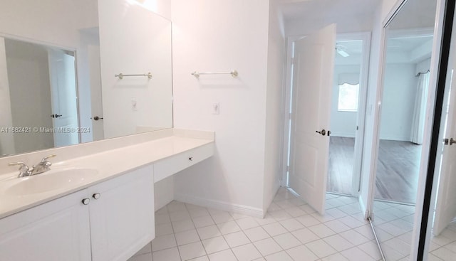 bathroom with tile patterned flooring and vanity