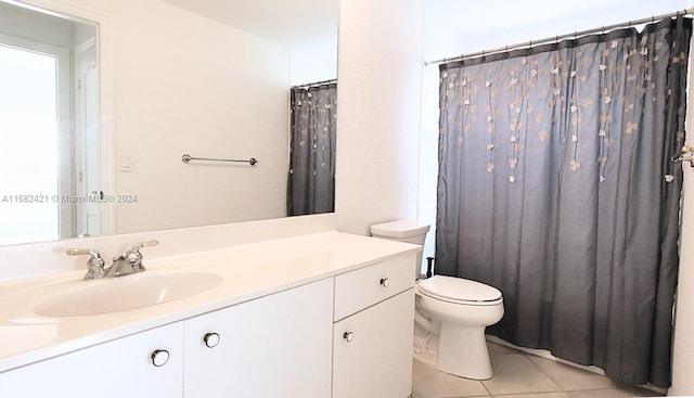 bathroom with tile patterned flooring, vanity, toilet, and a shower with curtain