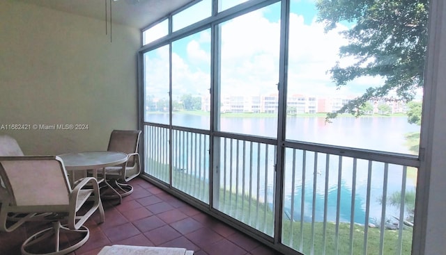 sunroom with a water view