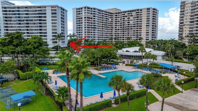 view of pool with a yard and a patio area