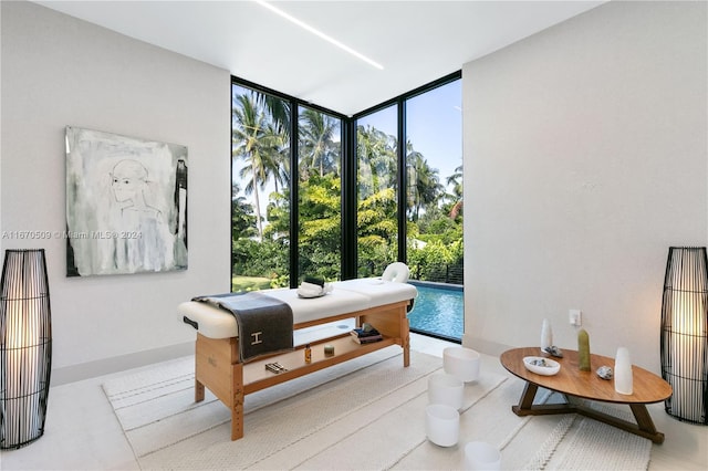 bedroom featuring a wall of windows