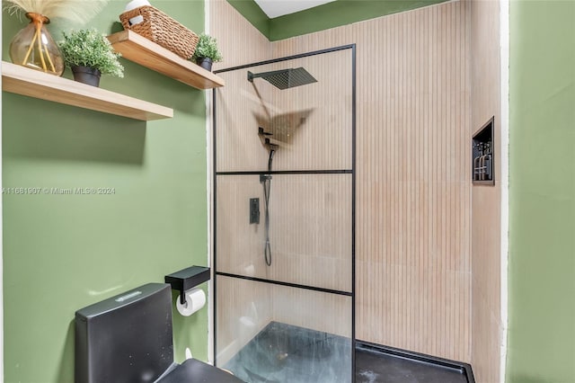 bathroom with tiled shower