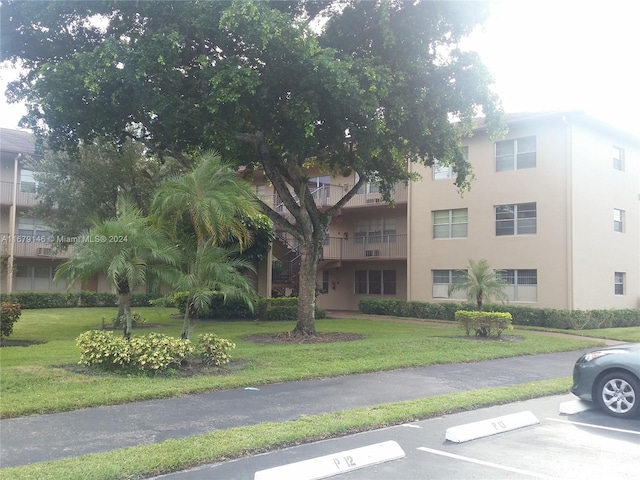 13350 SW 1st St Unit 109P, Pembroke Pines, FL 33027 - view of building exterior with uncovered parking