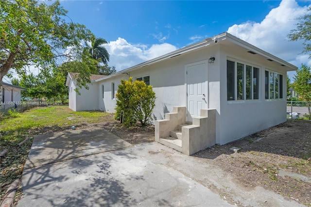 view of side of home featuring a patio area