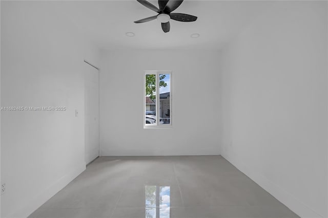 unfurnished room with ceiling fan