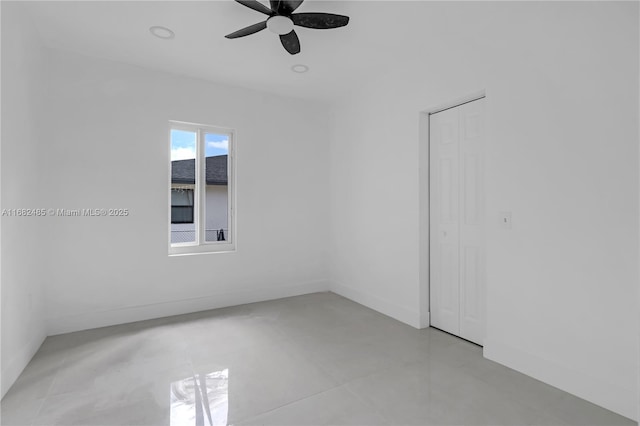 unfurnished room with ceiling fan