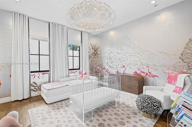 406 Tamarind Dr, Hallandale Beach, FL 33009 - living room with wood finished floors and a chandelier