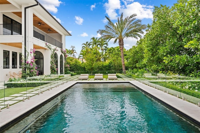 view of pool featuring ceiling fan