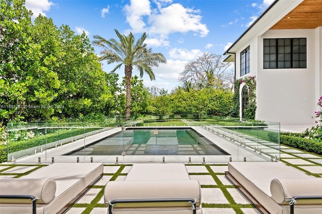 view of swimming pool with a patio area