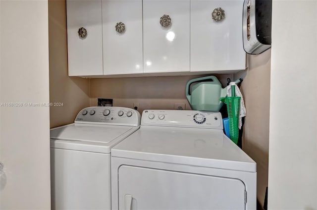 clothes washing area featuring separate washer and dryer