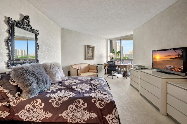 carpeted bedroom featuring a textured ceiling