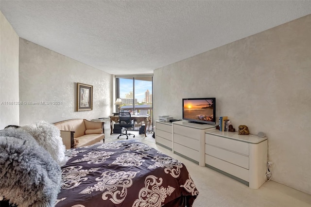 carpeted bedroom with a textured ceiling