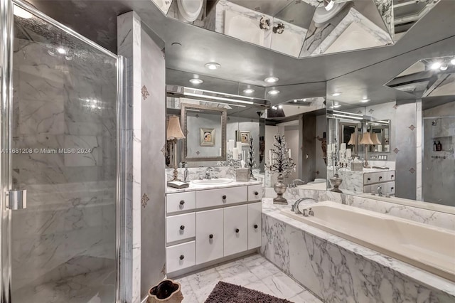 bathroom featuring vanity and separate shower and tub