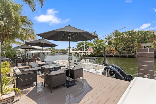 dock area with a water view and an outdoor hangout area