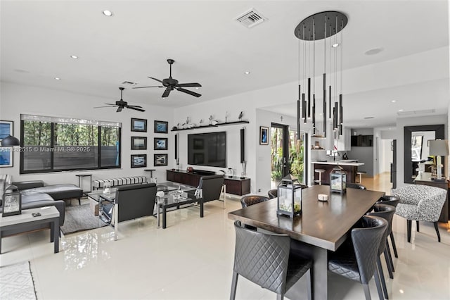 tiled dining area featuring plenty of natural light and ceiling fan